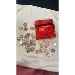 Red floral brocade change pouch with tassel and 42 coins from other nations